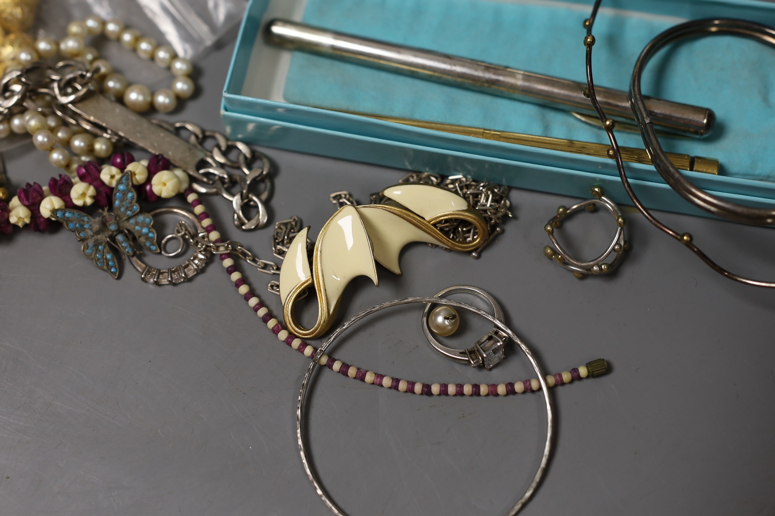 Mixed costume jewellery including filigree bracelet, bangles etc. and other items including two pens and a fob watch.